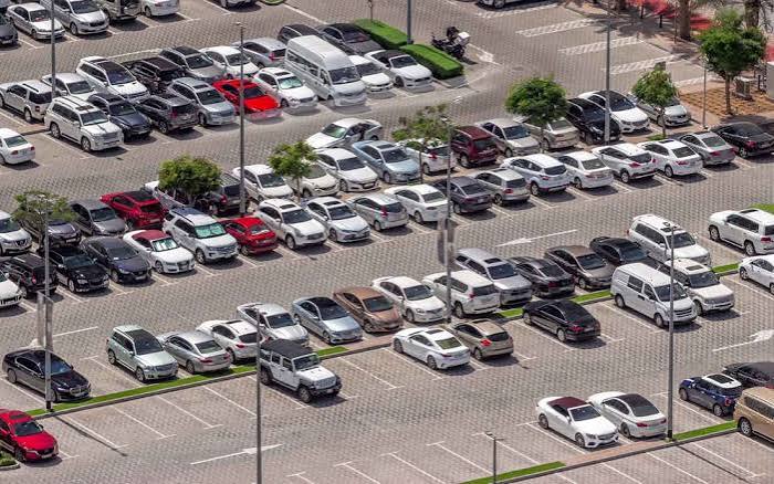 Large outdoor used-car parking lot in Dubai