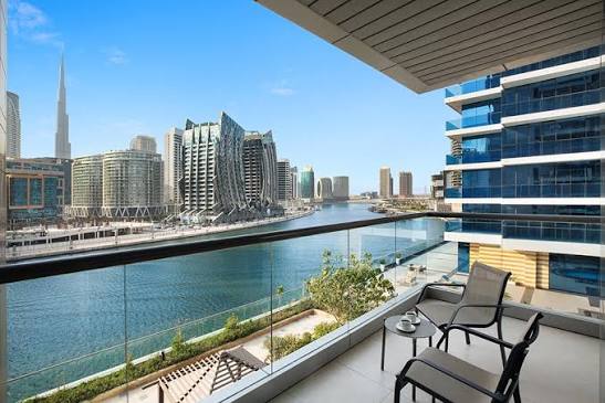 Apartment balcony overlooking Dubai Water Canal and residential towers